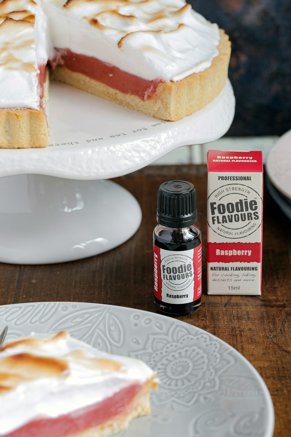 black and white labeled bottle beside white ceramic plate