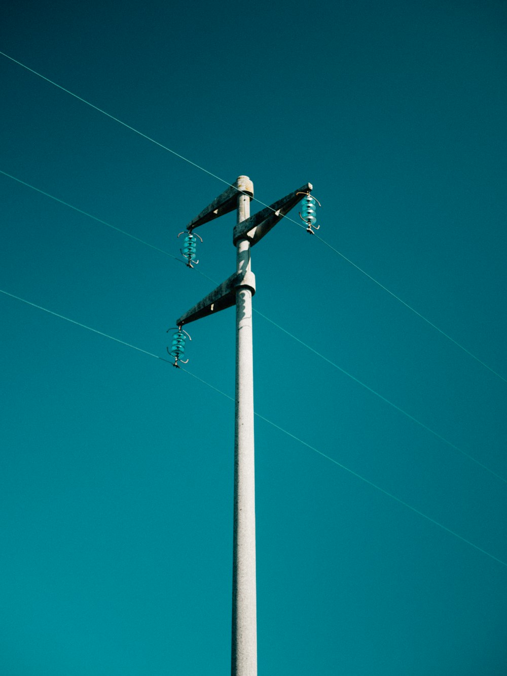 a street light with a blue sky in the background