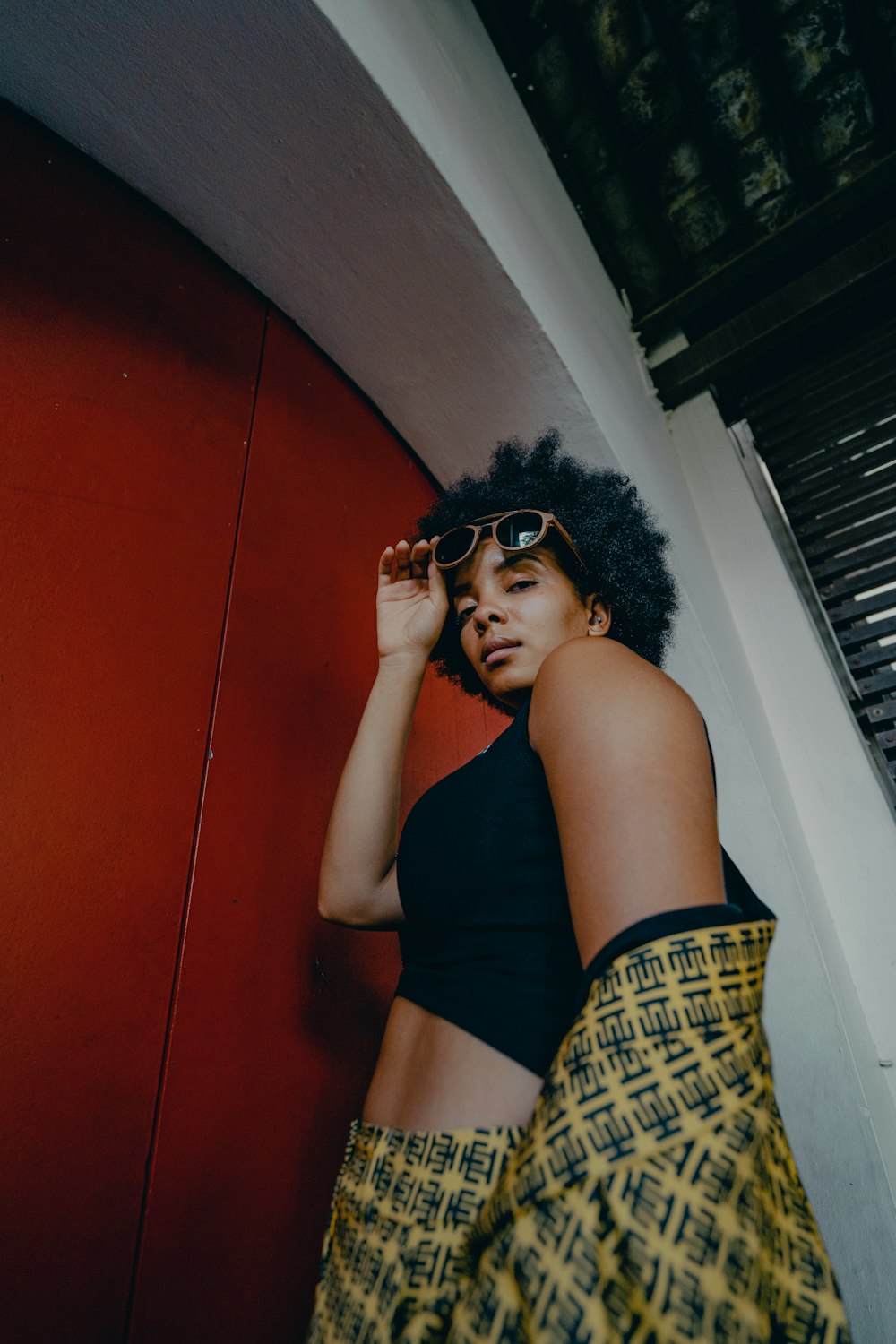 woman in black tank top wearing black sunglasses