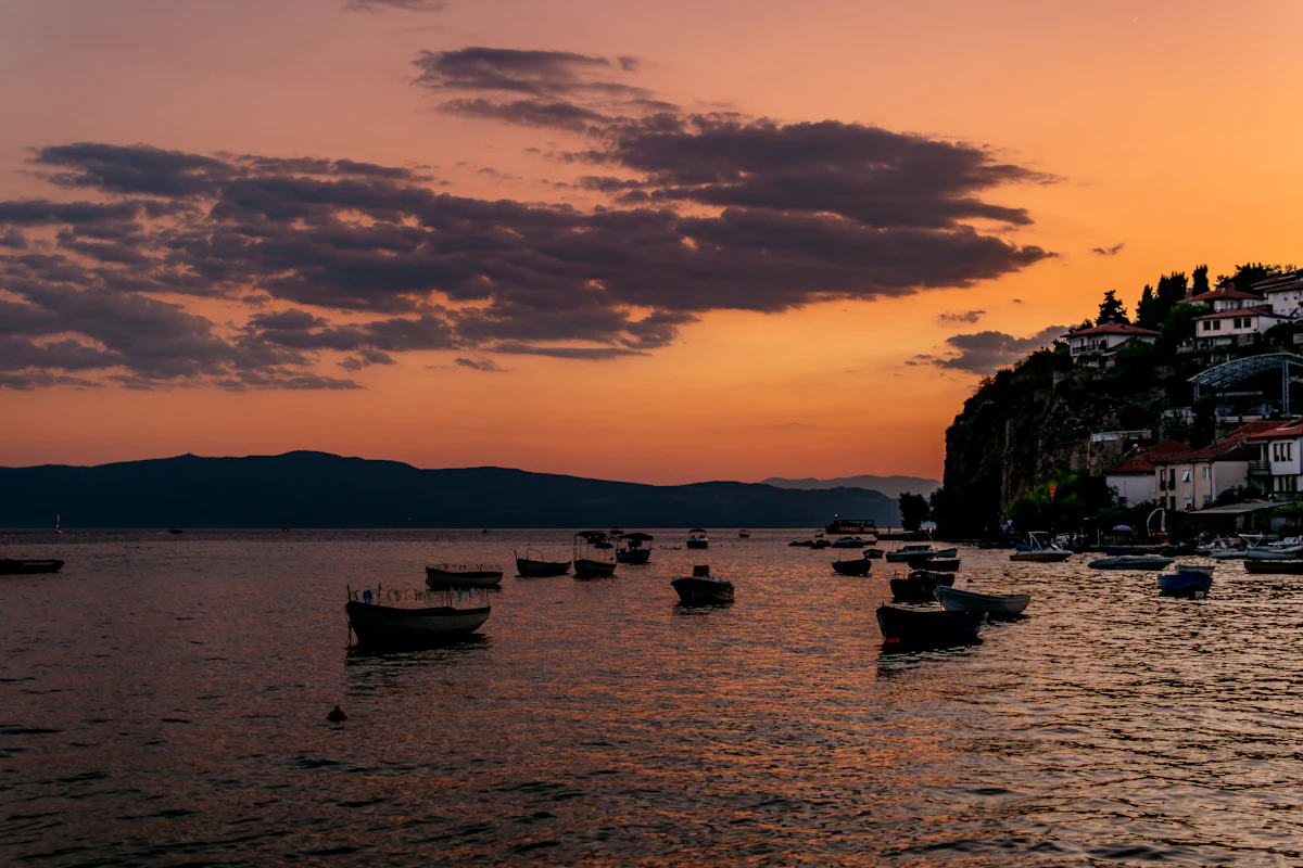 A boat, and the sun going down