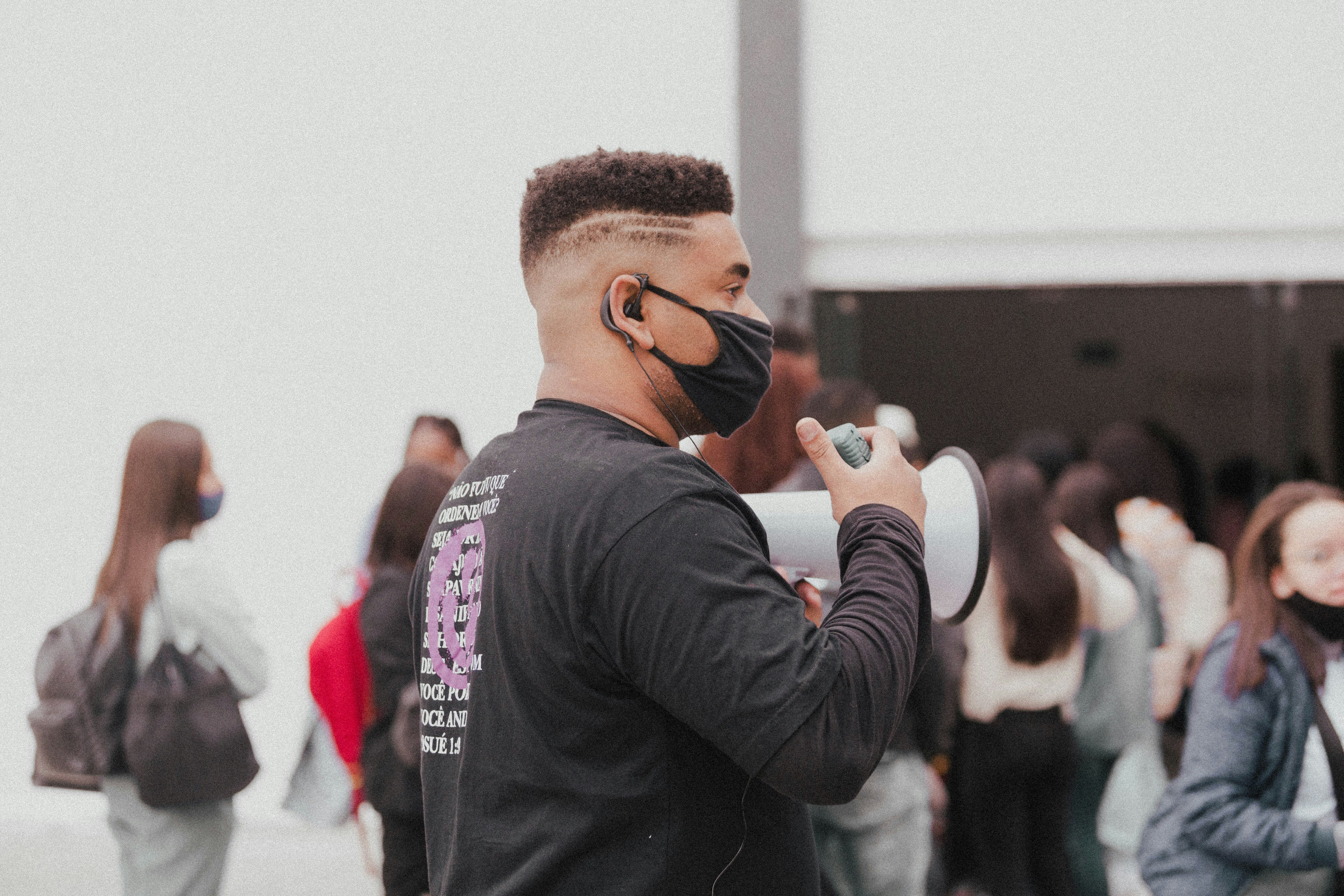 man in black long sleeve shirt wearing black sunglasses
