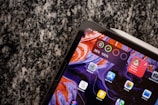 A close-up of a person using software on a tablet.