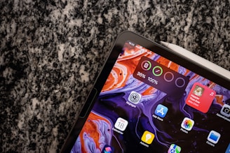 A close-up of a digital tablet displaying vibrant graphics and design tools.