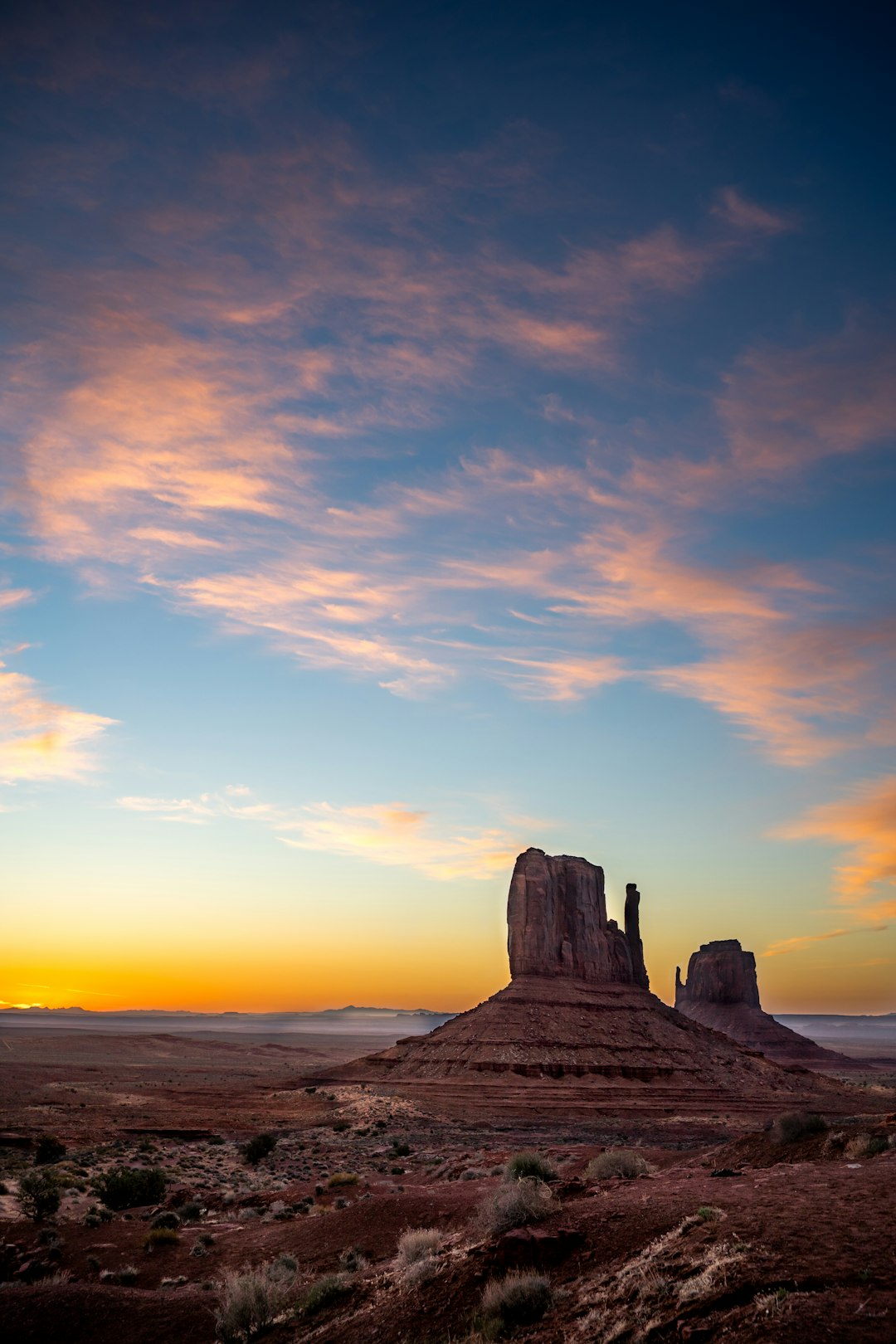 brown rock formation under white clouds during daytime