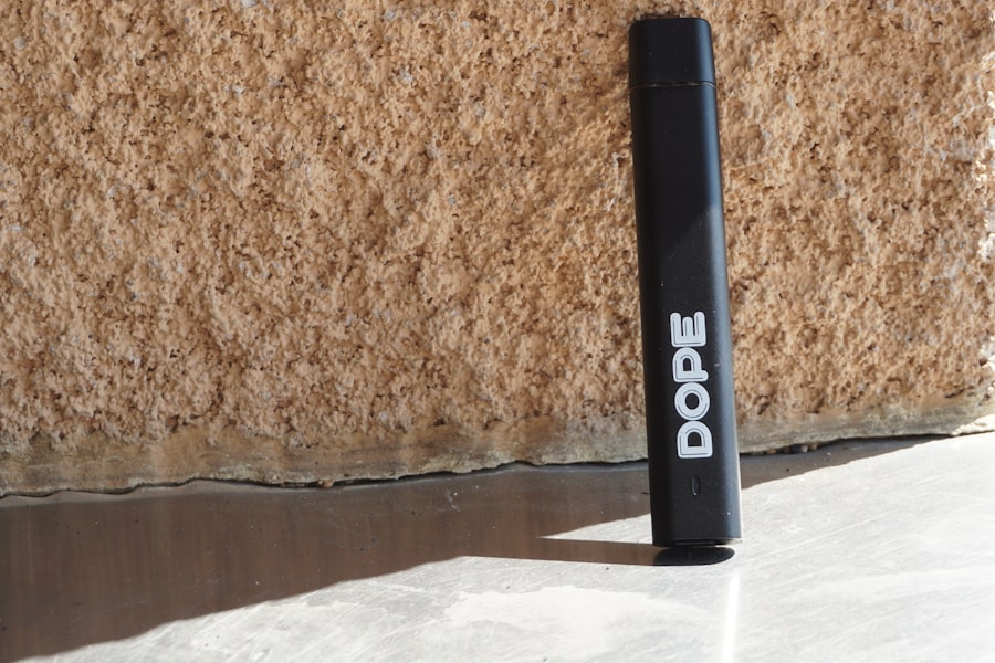 Cannabis vaporizer device on brown marble table surface
