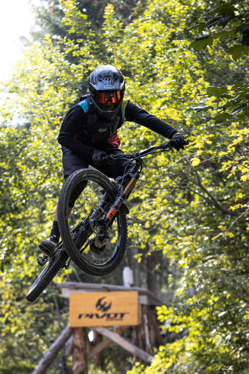 man in black jacket riding bicycle during daytime