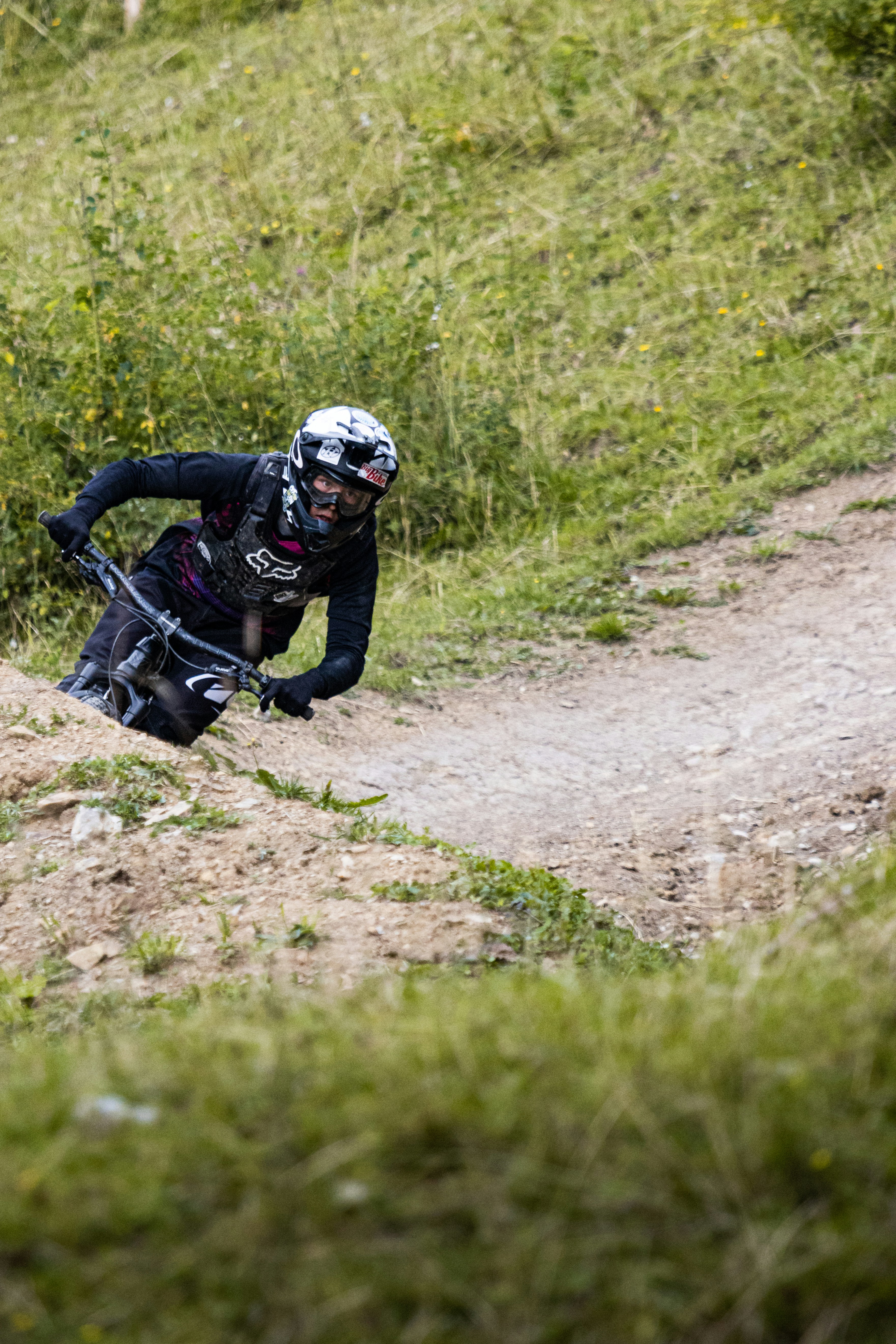 man in black jacket and helmet riding on black motorcycle during daytime