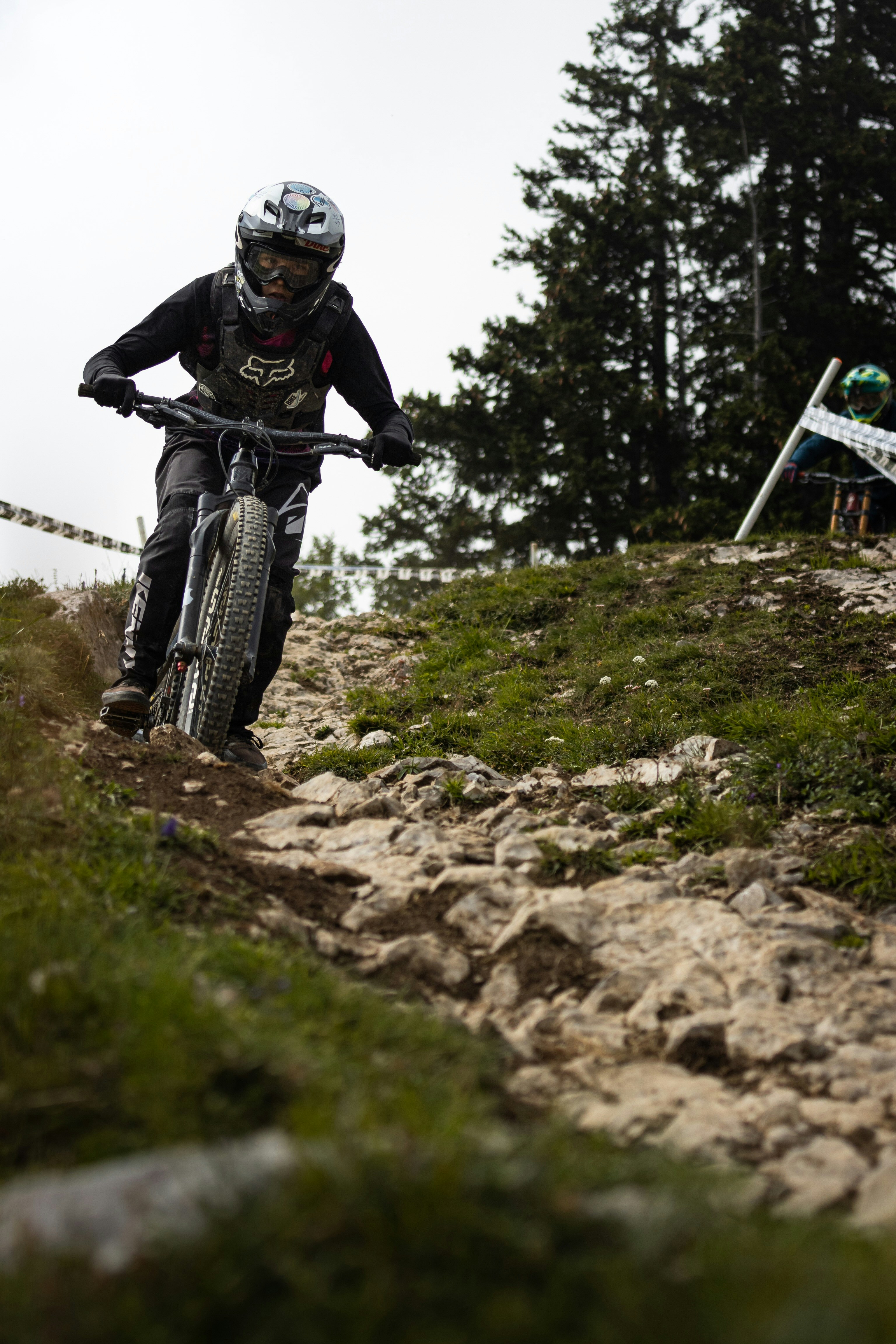 man riding on mountain bike on green grass field during daytime
