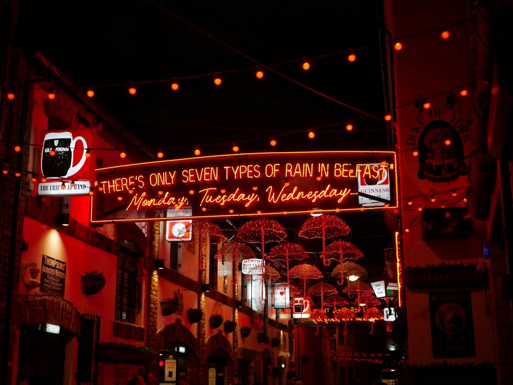 red and white store front during night time