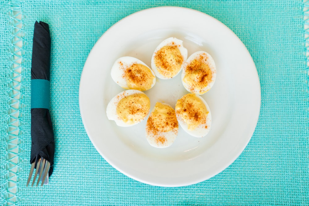 blue round fruits on black round plate