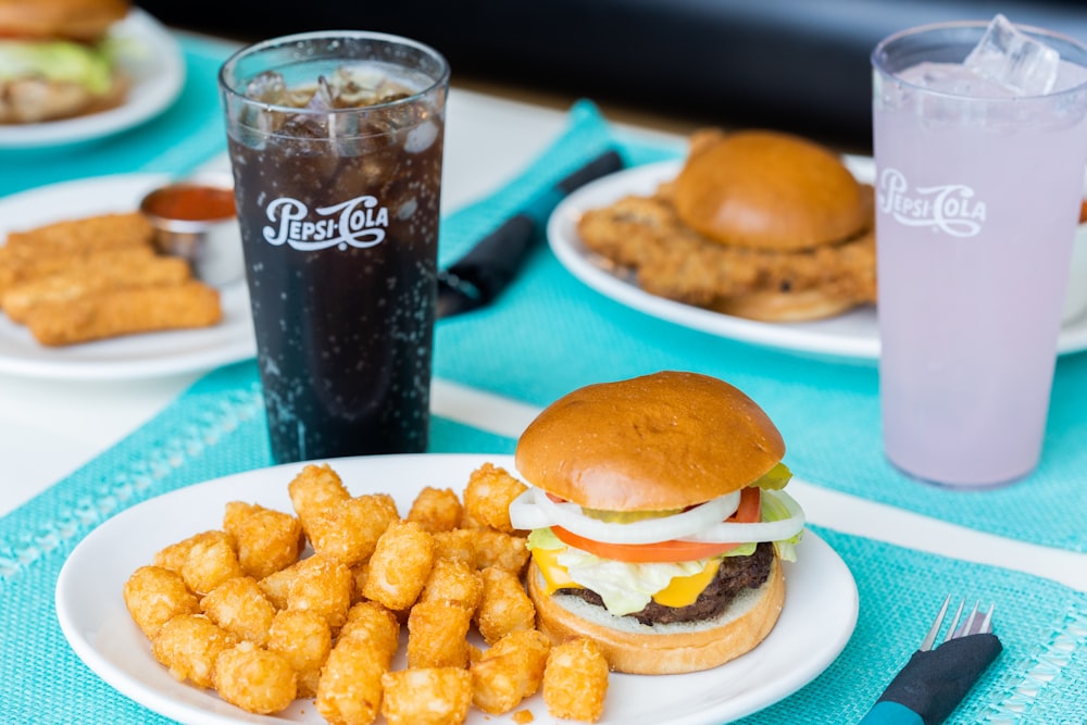 burger and fries on blue plate