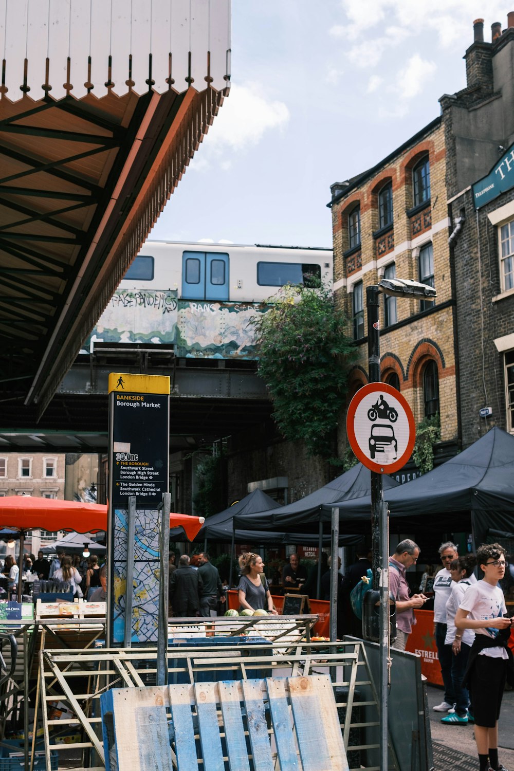 people sitting on chair near building during daytime