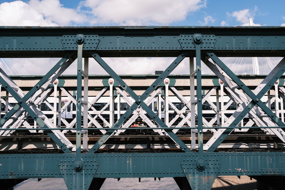 white metal bridge under blue sky during daytime