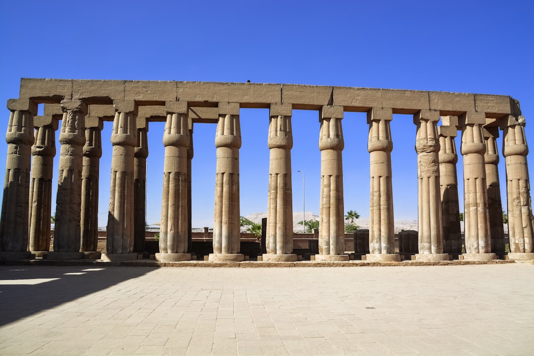 beige concrete pillars under blue sky during daytime