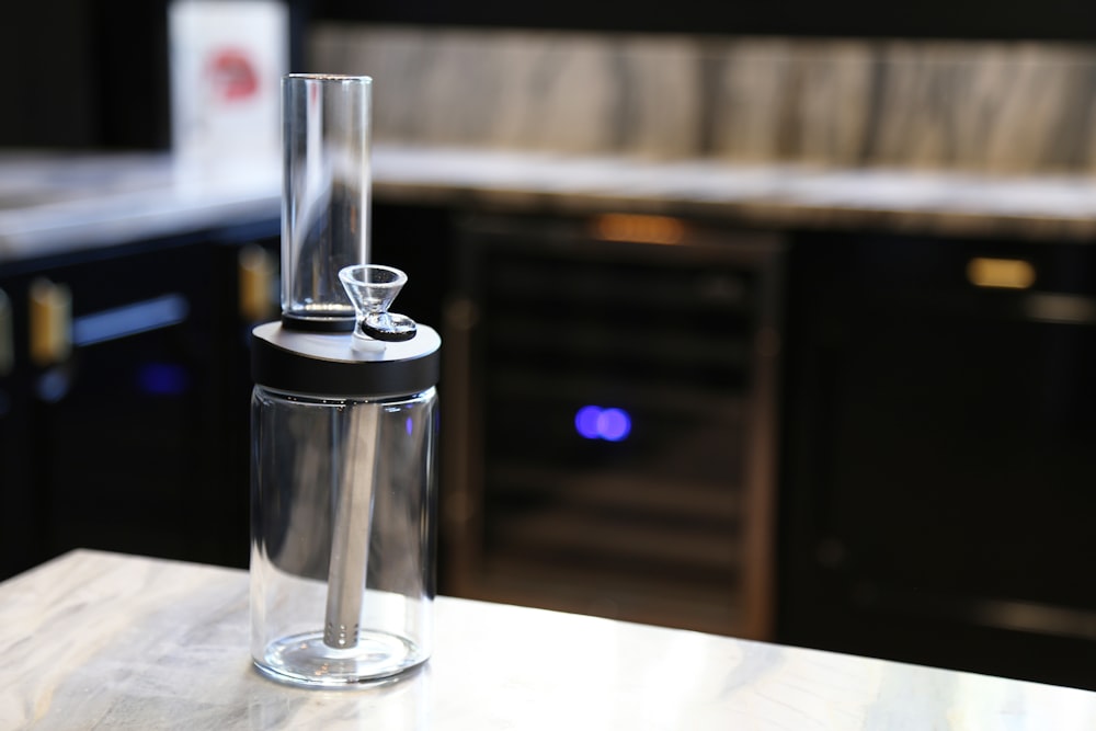 stainless steel vacuum flask on white table