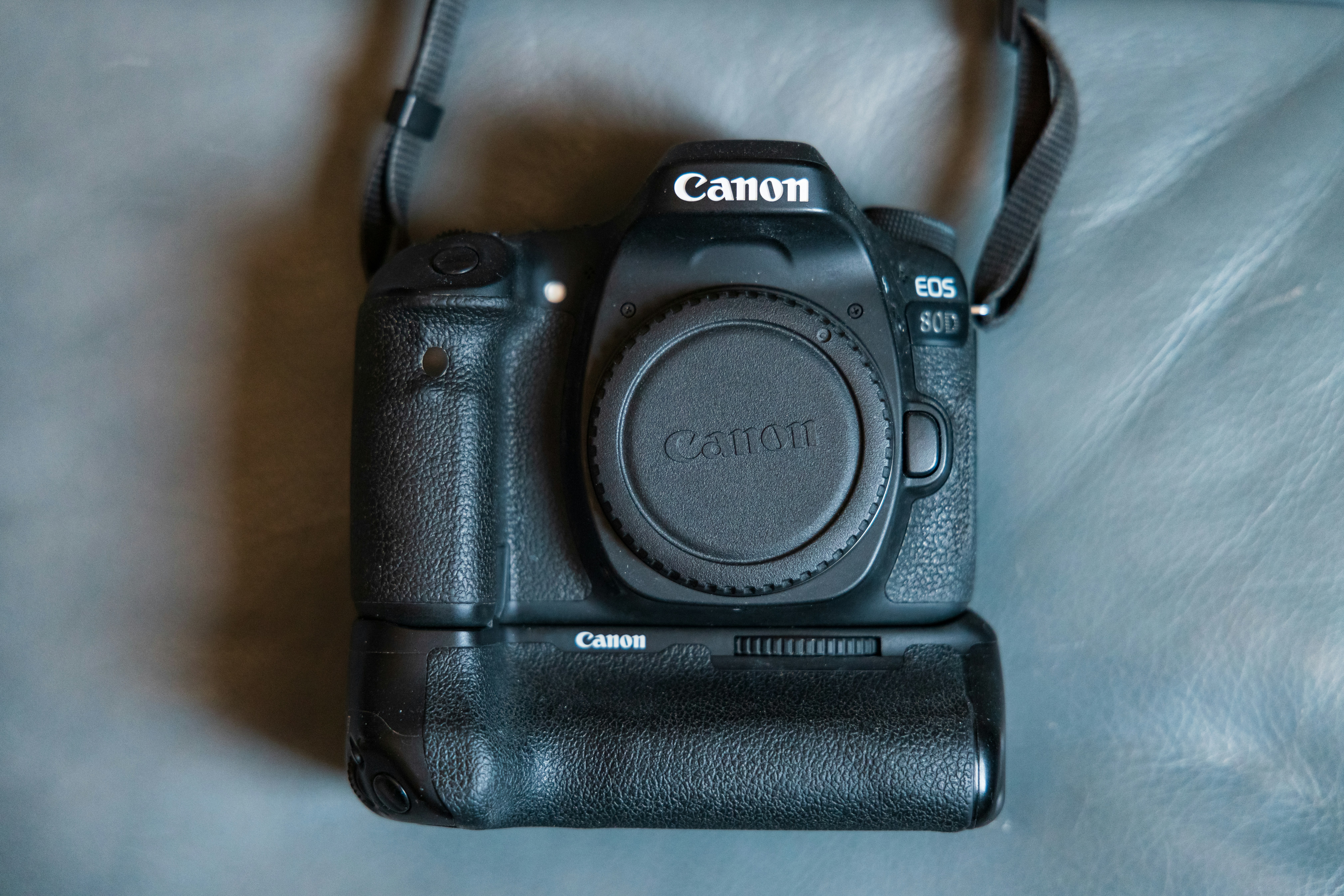 black nikon dslr camera on white table