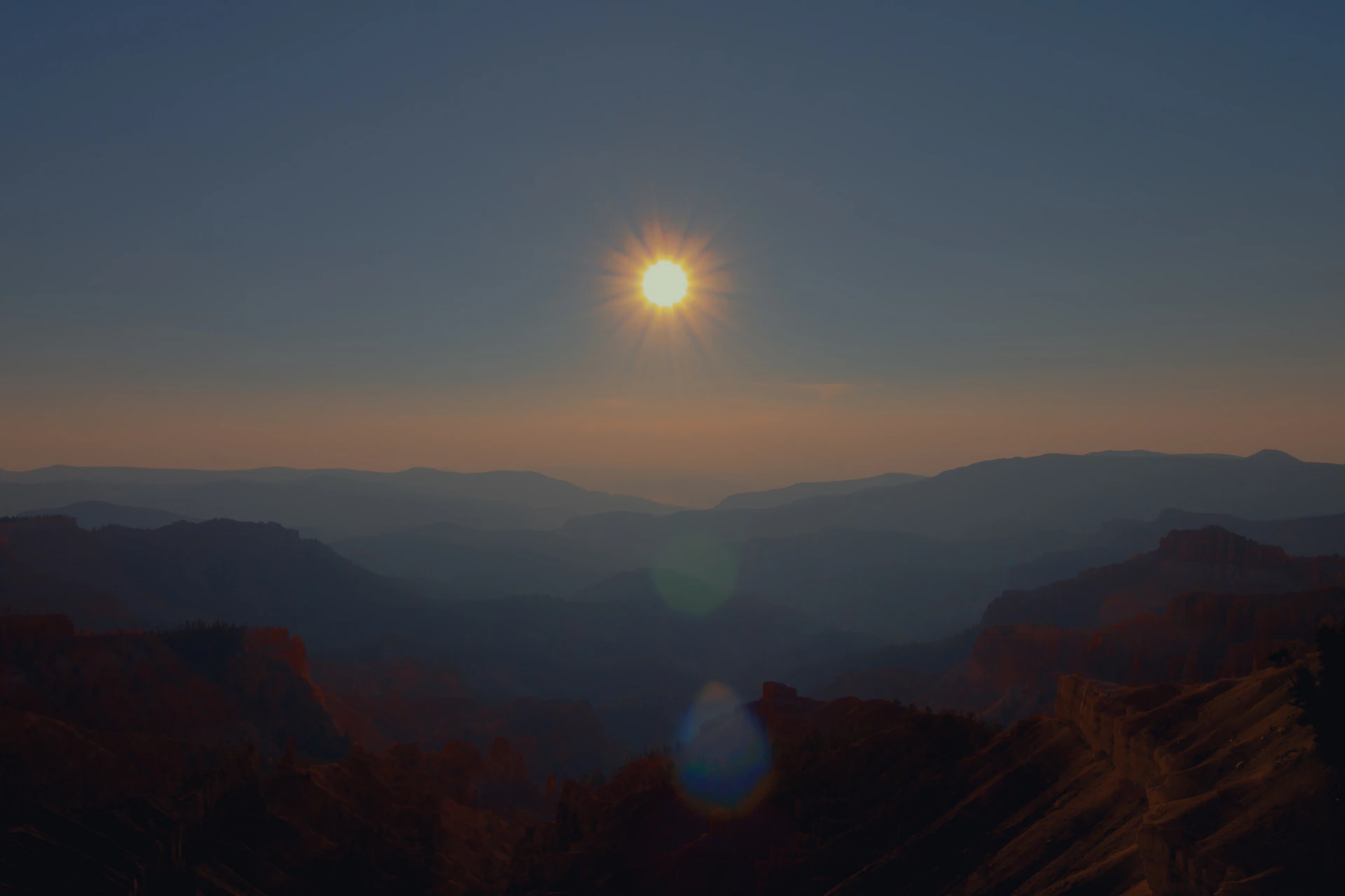 sun setting over the mountains