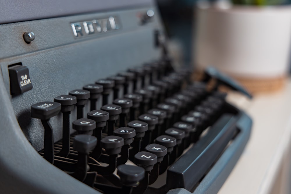 black and white typewriter on white table