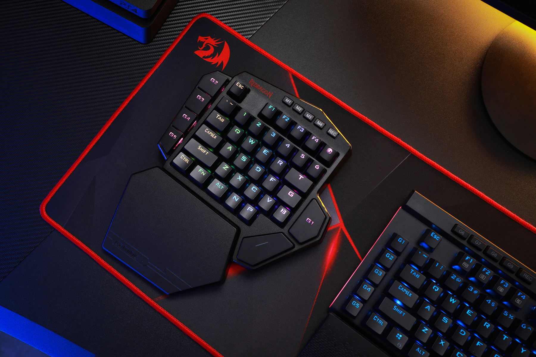 Gaming keyboard and desk equipment arranged in an illuminated esports setup