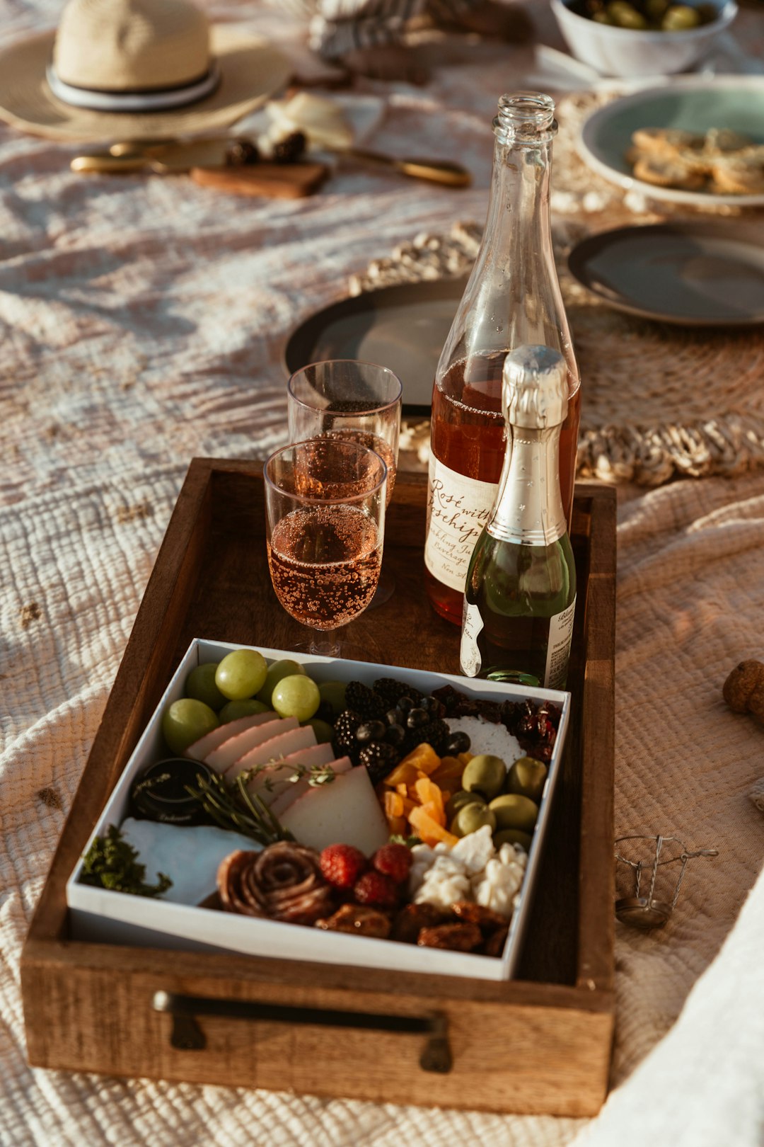 clear glass bottle on brown wooden table