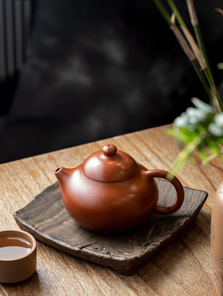 A red Yixing clay teapot