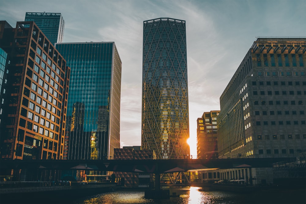 a river running through a city next to tall buildings