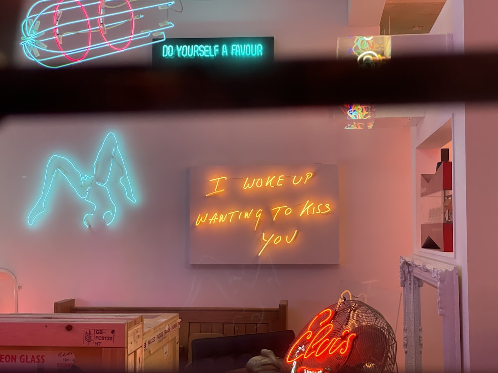 a room with neon signs on the wall