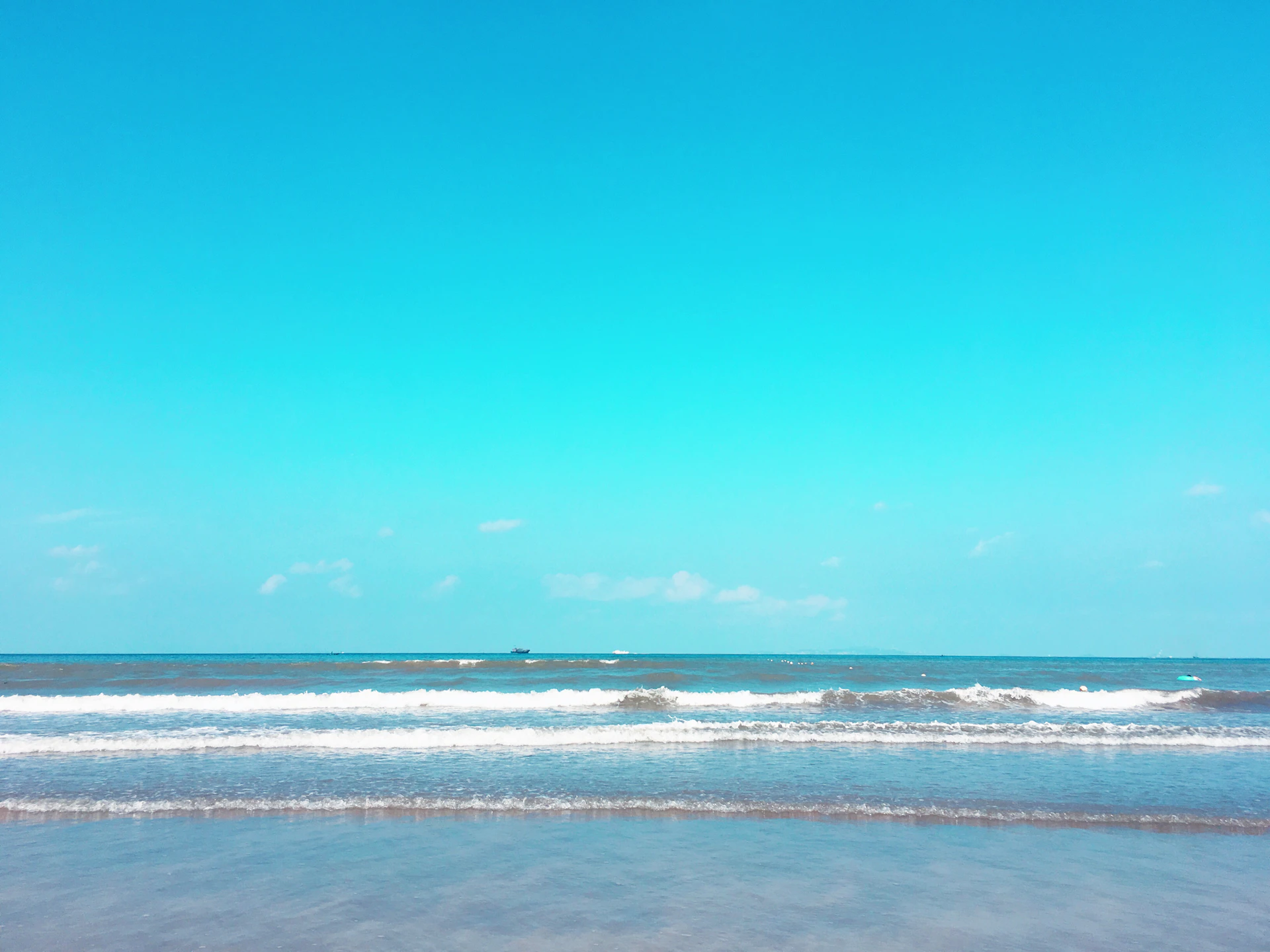 blue sea under blue sky during daytime