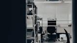An office workspace with computers and accounting books.