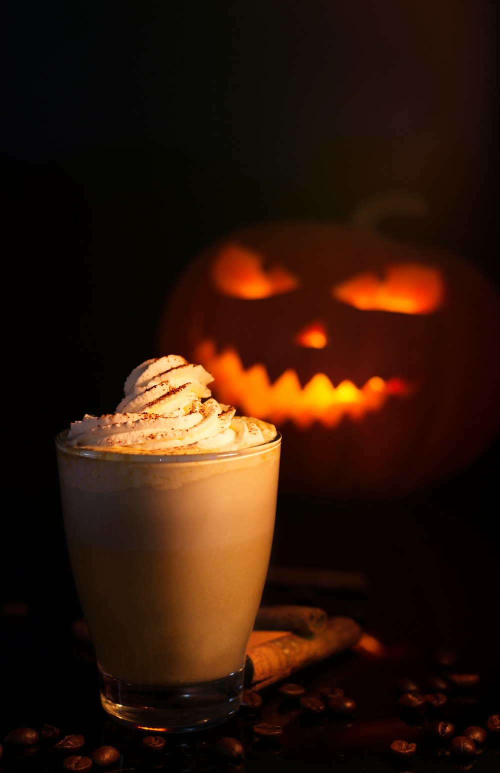 white and brown cupcake with jack o lantern