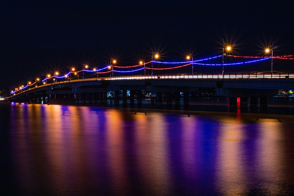 bridge over water during night time