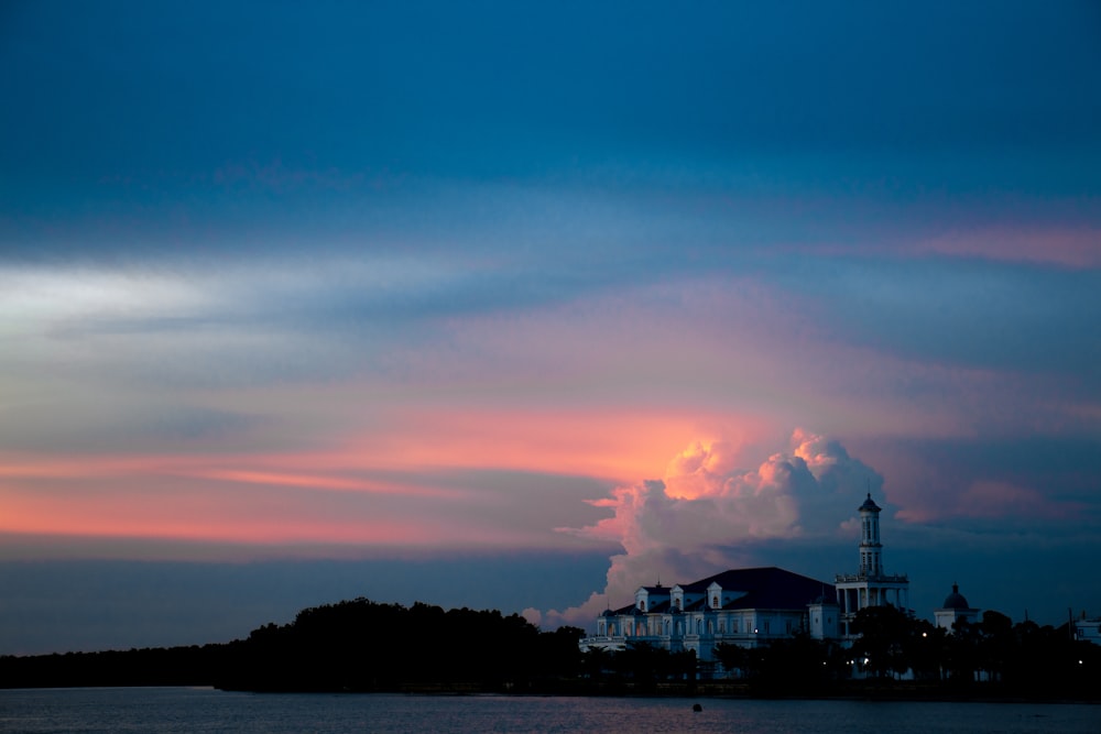 silhouette of building during sunset