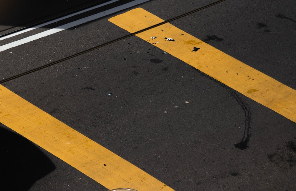 yellow line on gray asphalt road
