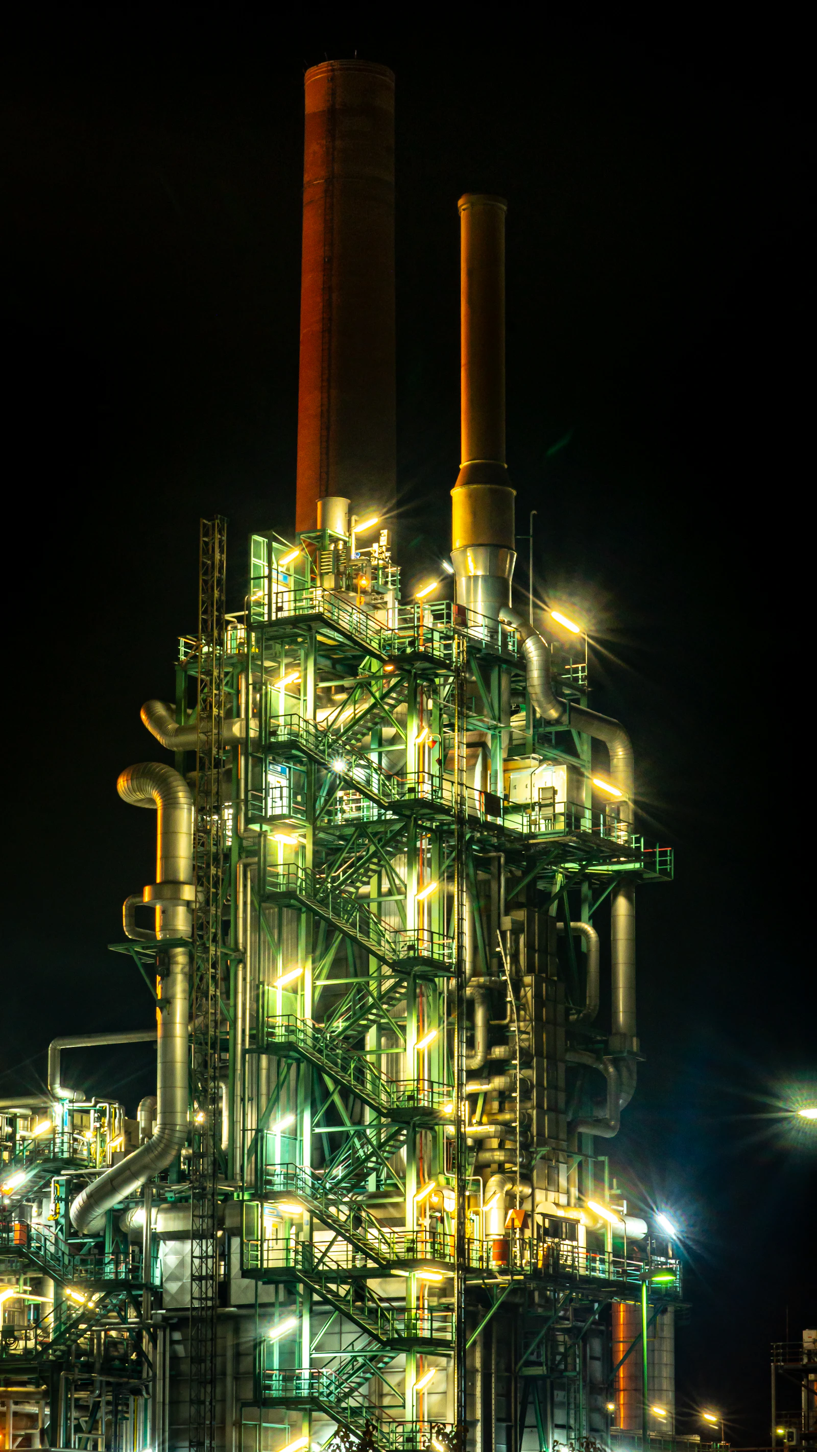  Dusk view of a Chinese chemical industrial park in Jiangsu province showing most factory buildings dark and stack flares out, illustrating the September 2021 dual control power rationing shutdowns that idled production for weeks 