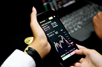 person holding black android smartphone