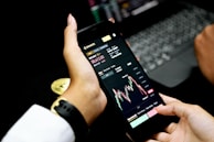 person holding black android smartphone