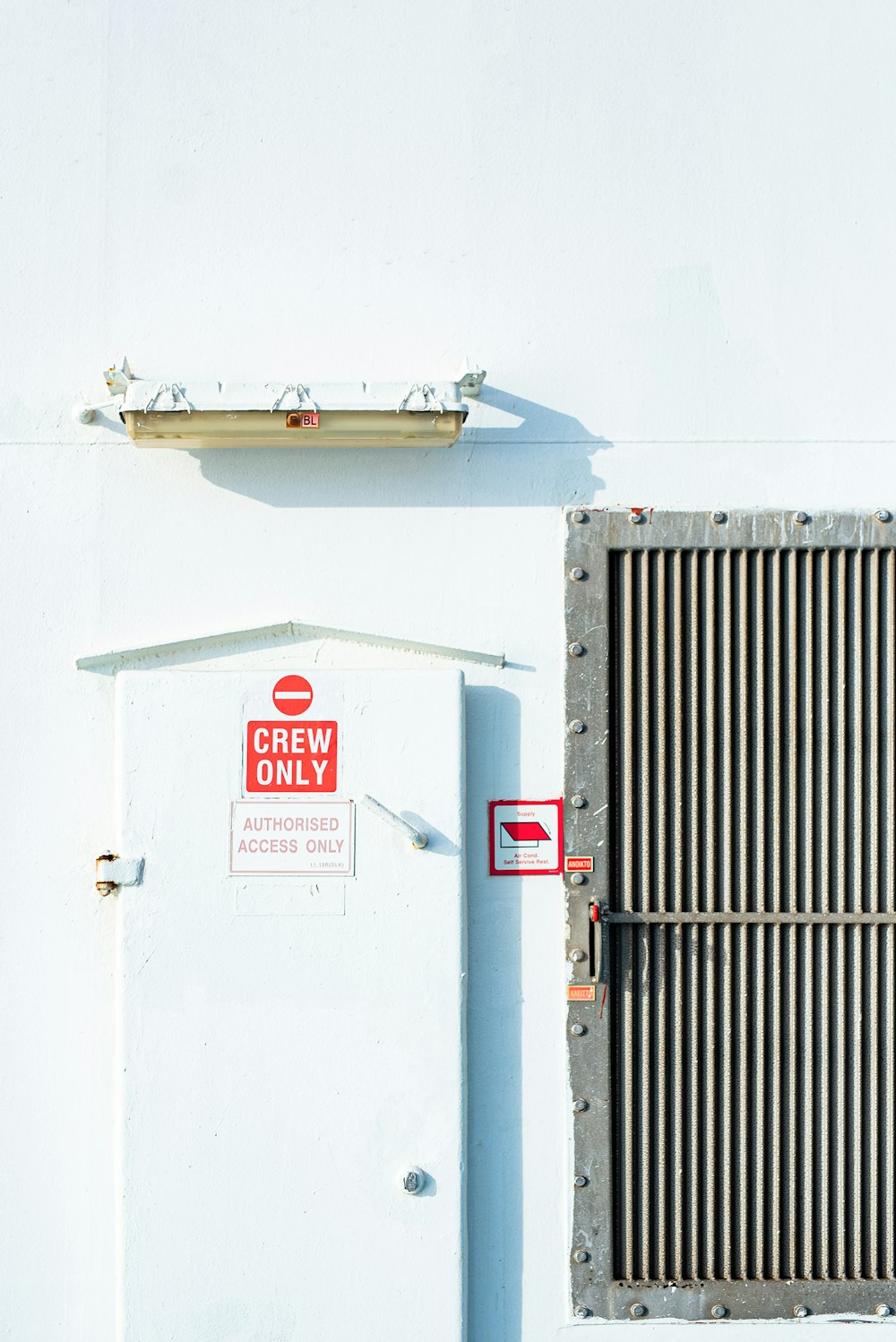 white and red wall mounted signage