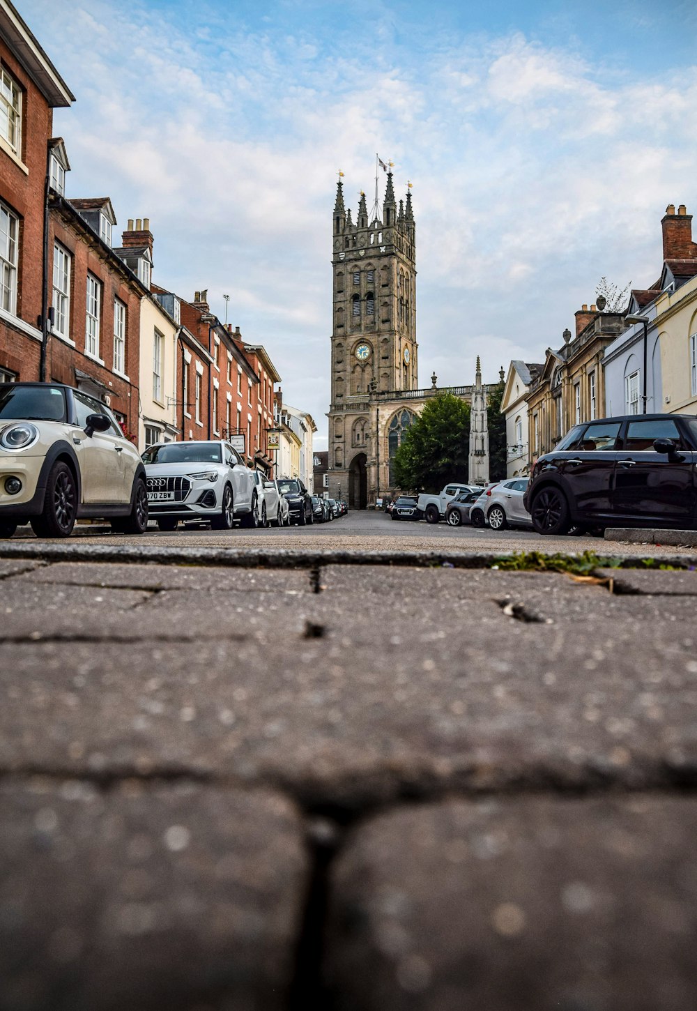 cars parked on side of the road during daytime