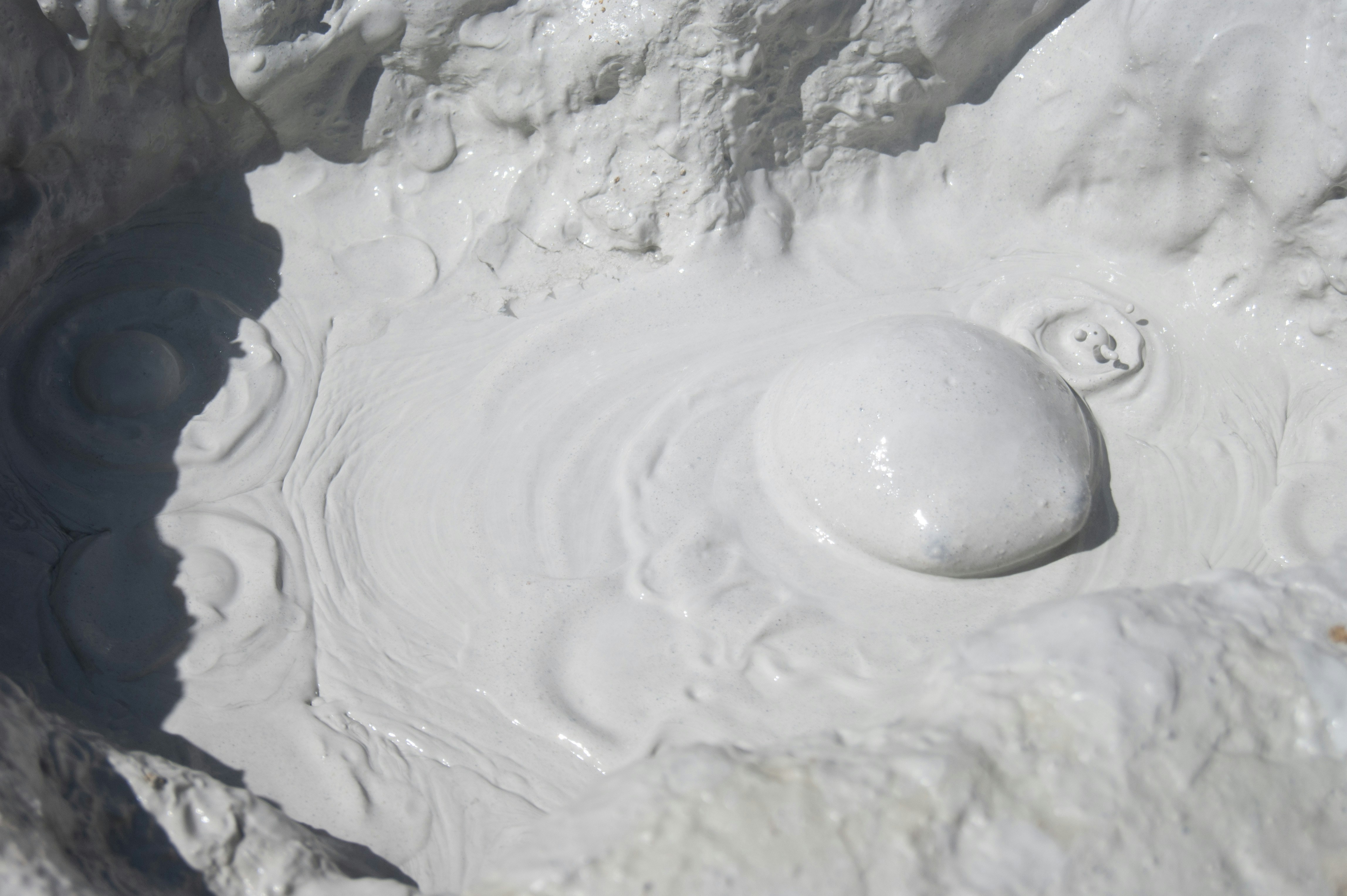 white snow on gray rocky ground