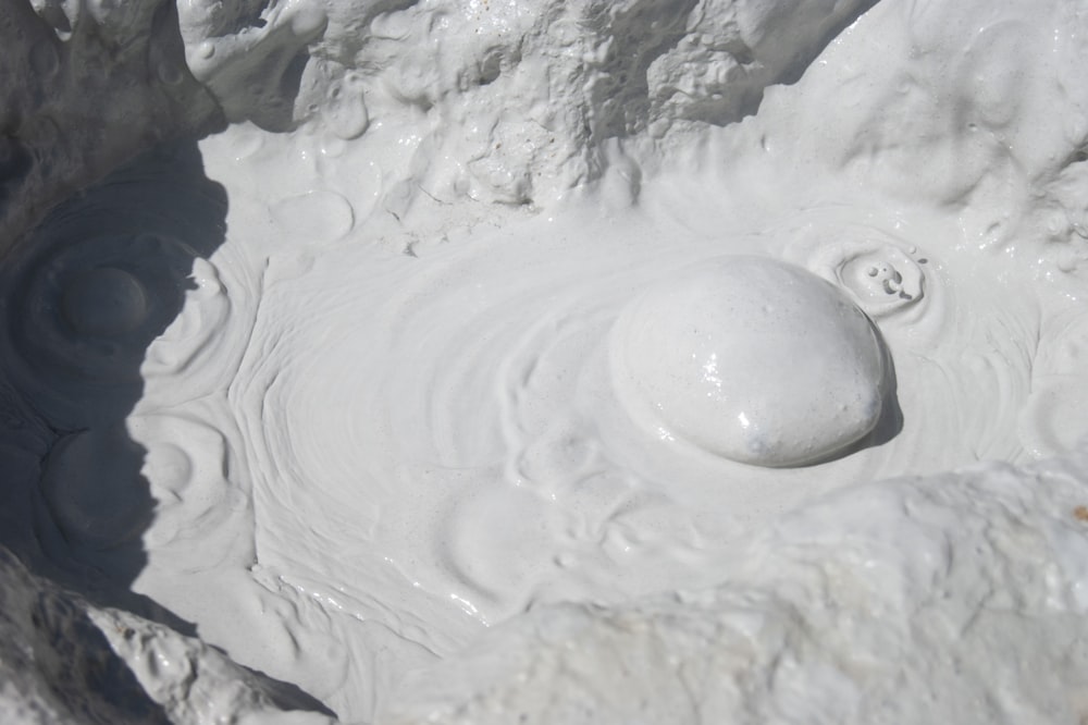 white snow on gray rocky ground