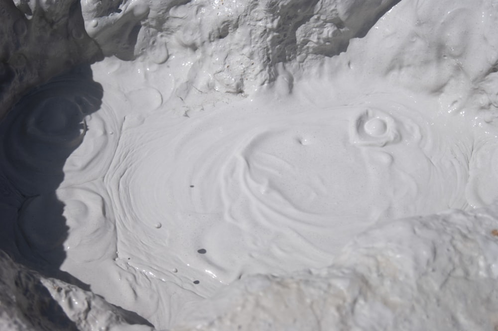 white snow on gray rocky mountain