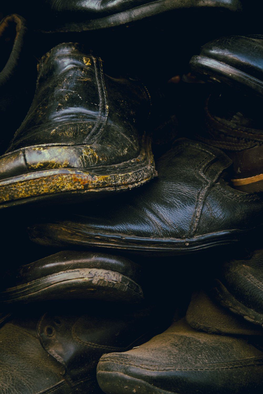 black leather boots on brown textile