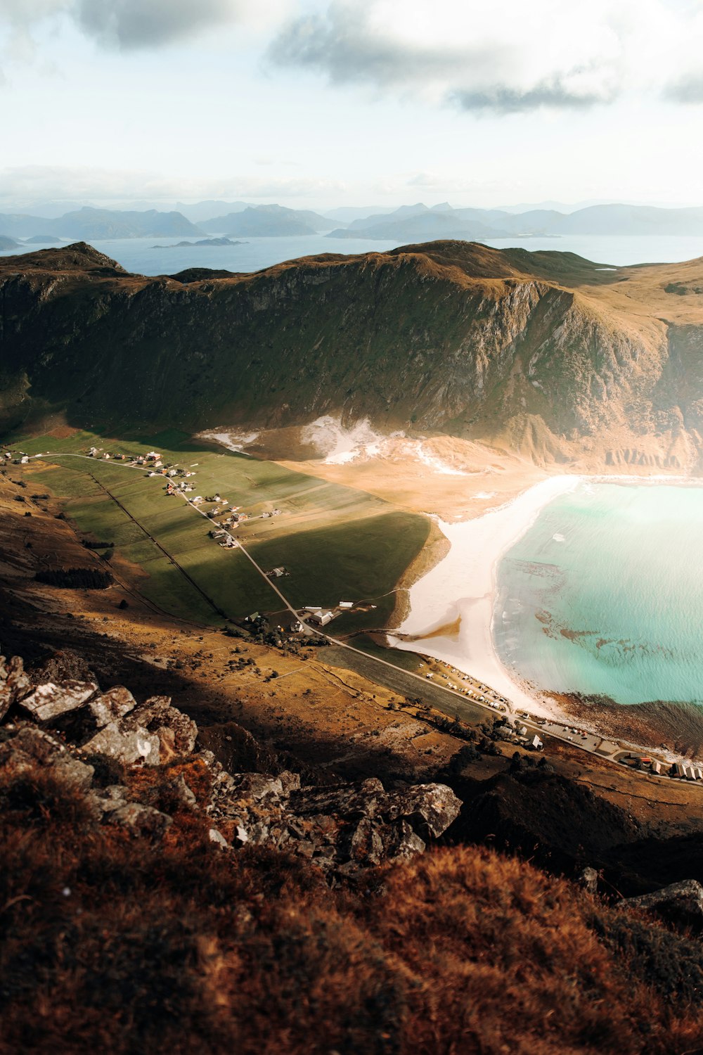 aerial view of lake and mountains during daytime