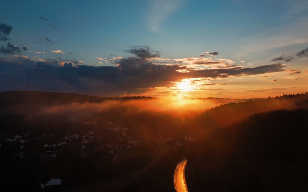 sun setting over the clouds