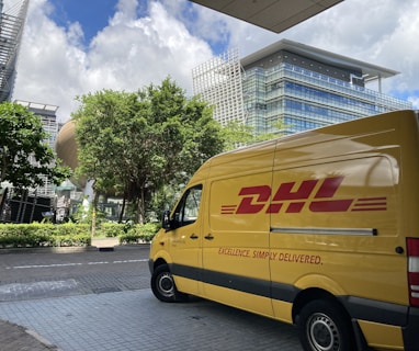 yellow van parked on sidewalk during daytime