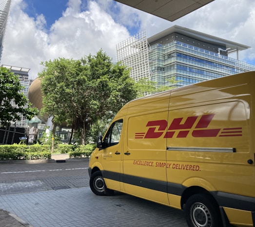 yellow van parked on sidewalk during daytime