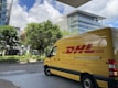 yellow van parked on sidewalk during daytime