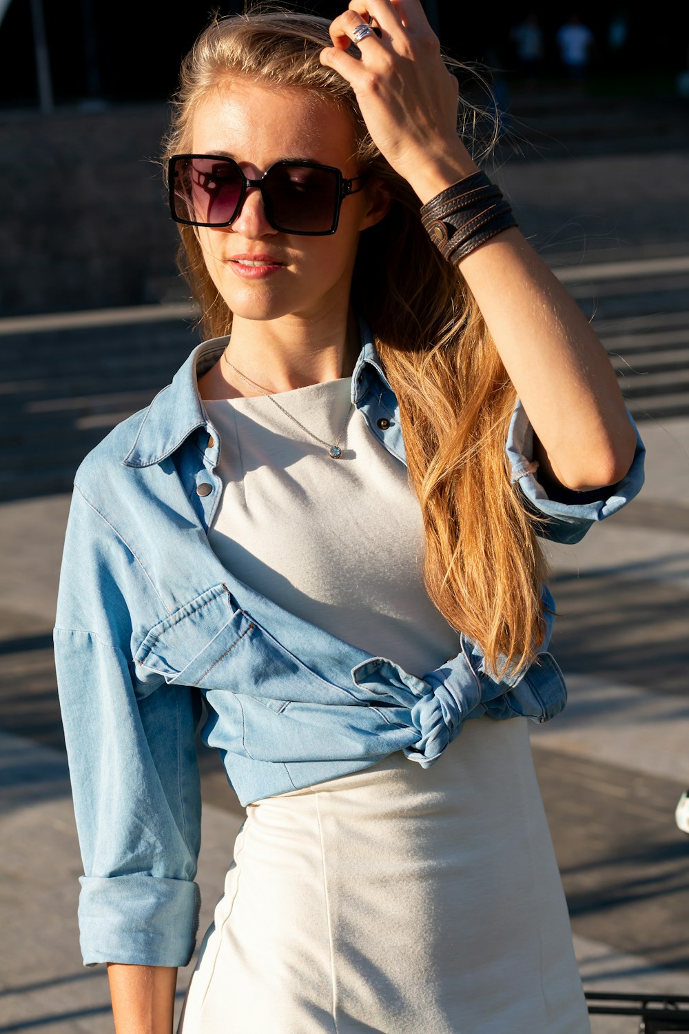 woman in blue denim button up jacket and white shirt