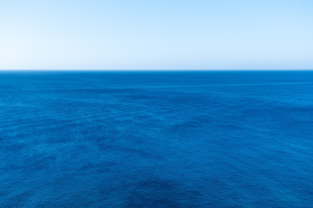 blue ocean under blue sky during daytime