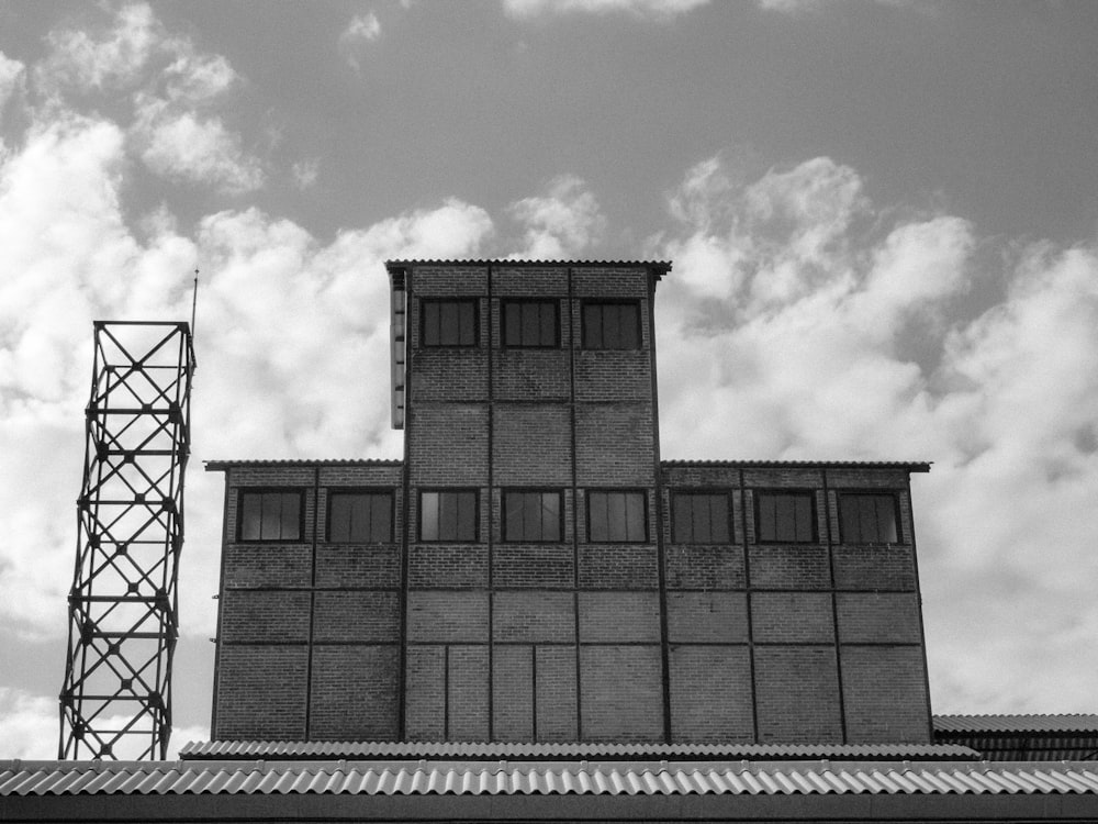 grayscale photo of brick building
